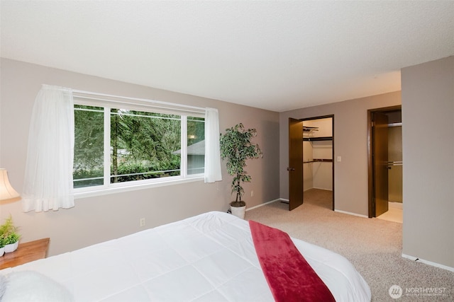 carpeted bedroom featuring baseboards