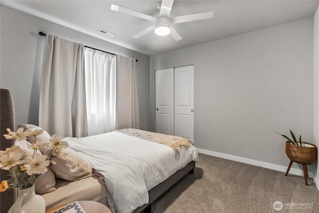 bedroom featuring visible vents, baseboards, carpet, a closet, and a ceiling fan