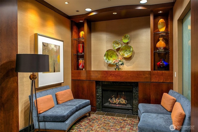 sitting room with recessed lighting and a tile fireplace