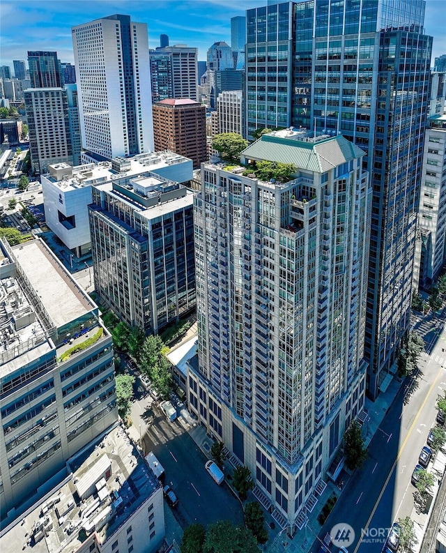 birds eye view of property featuring a city view