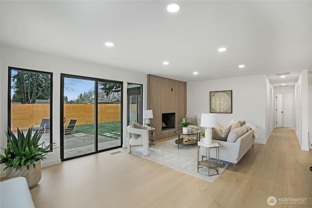 living area featuring recessed lighting and light wood-style flooring