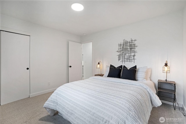 bedroom featuring baseboards and carpet floors