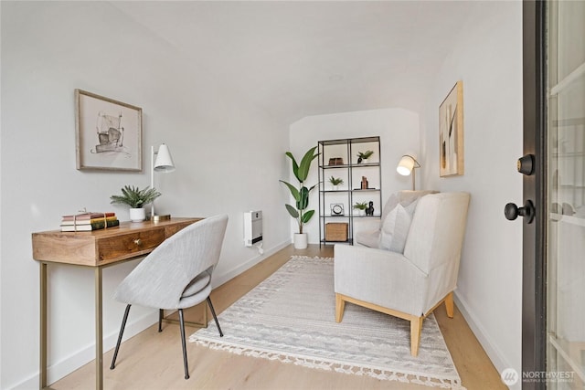 home office featuring baseboards and light wood-style floors