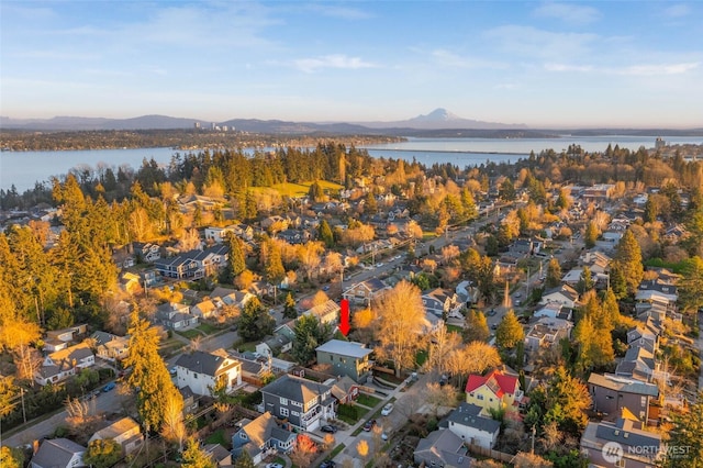 bird's eye view featuring a residential view and a water and mountain view