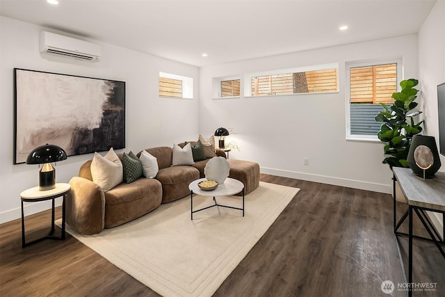 living room featuring dark wood-type flooring, recessed lighting, baseboards, and a wall mounted air conditioner