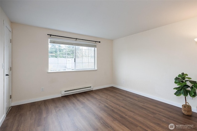 unfurnished room featuring baseboards, baseboard heating, and wood finished floors