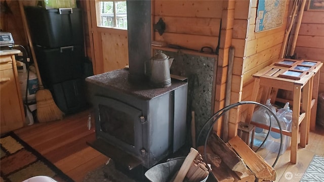 2001 N Dow Mountain Rd, Hoodsport, WA 98548 - details featuring wooden walls, a wood stove, and wood finished floors