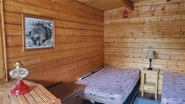 2001 N Dow Mountain Rd, Hoodsport, WA 98548 - unfurnished bedroom featuring wooden walls and wooden ceiling