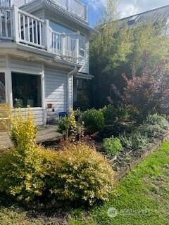 back of property with a balcony