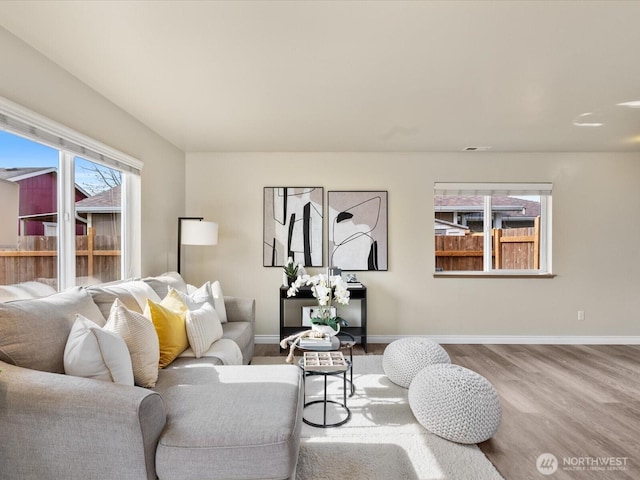 living room with wood finished floors and baseboards