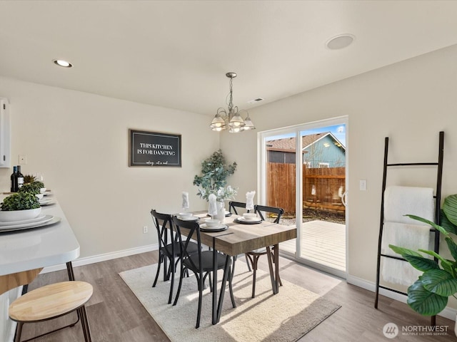 dining area with visible vents, baseboards, a chandelier, recessed lighting, and wood finished floors