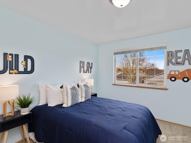 carpeted bedroom with baseboards