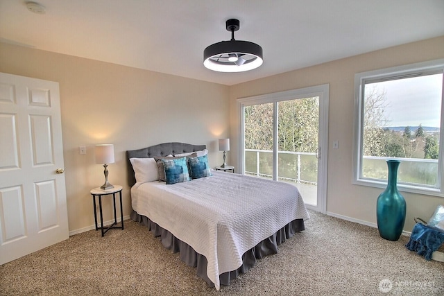 bedroom with baseboards, carpet, and access to exterior