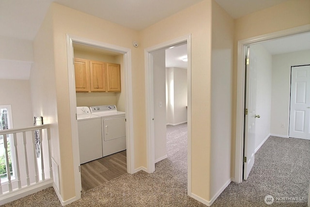 laundry room with baseboards, carpet, and washer and clothes dryer