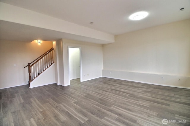 interior space featuring stairs, baseboards, and wood finished floors