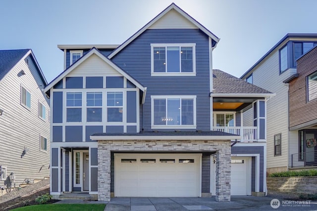 view of front of house with a garage, stone siding, driveway, and a shingled roof