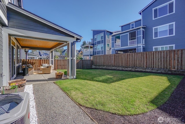 view of yard featuring central air condition unit, a fenced backyard, and a patio area