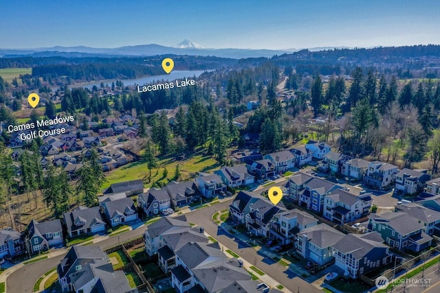 birds eye view of property featuring a mountain view and a residential view