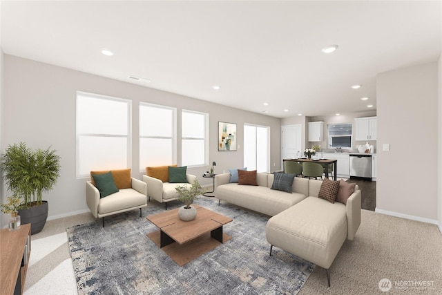 carpeted living room featuring recessed lighting and baseboards