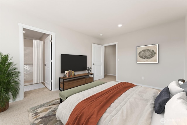 carpeted bedroom featuring baseboards