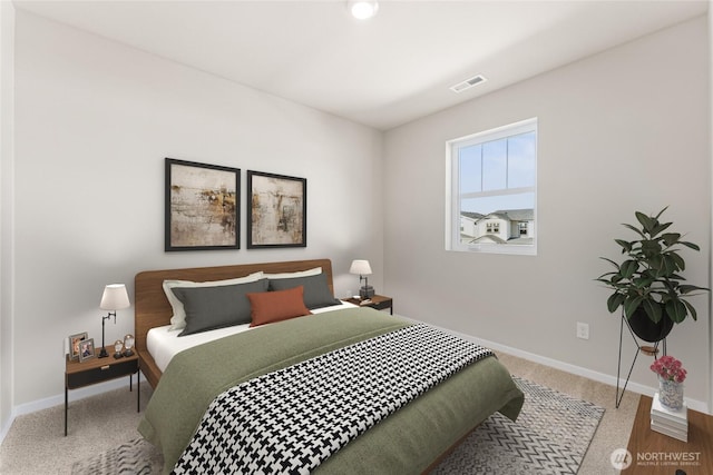 bedroom with visible vents and baseboards