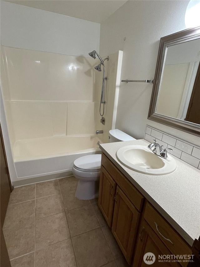 full bathroom with vanity, tile patterned floors, toilet, and bathing tub / shower combination