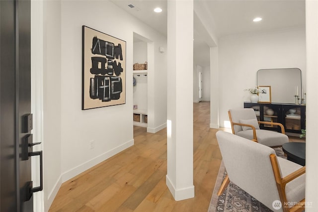 office with recessed lighting, light wood-style floors, baseboards, and ornamental molding