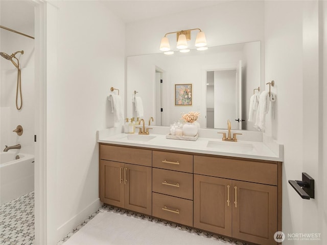 full bath with double vanity, washtub / shower combination, baseboards, and a sink