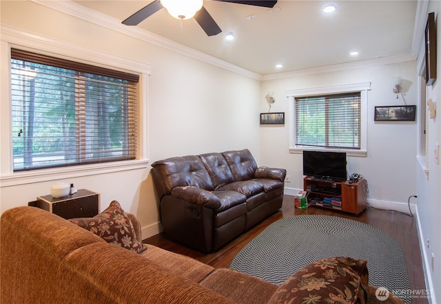 living room with ceiling fan, baseboards, wood finished floors, and ornamental molding