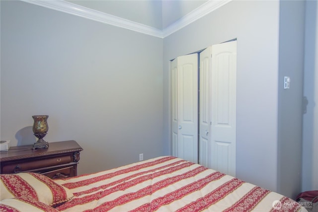 bedroom featuring a closet and ornamental molding