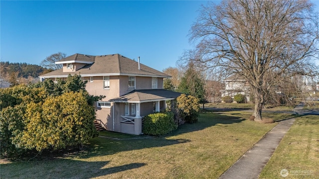 view of property exterior featuring stucco siding and a lawn