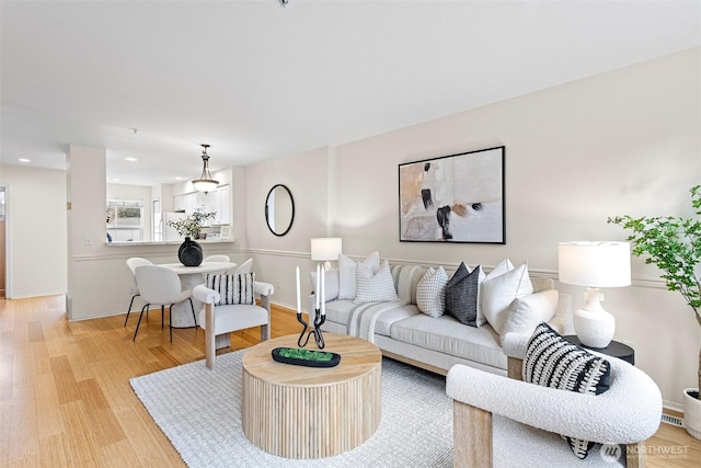 living area featuring recessed lighting and light wood-type flooring