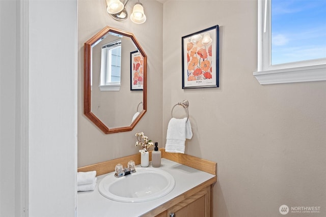 bathroom with a healthy amount of sunlight and vanity