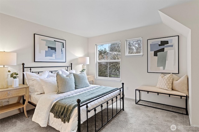 carpeted bedroom featuring baseboards