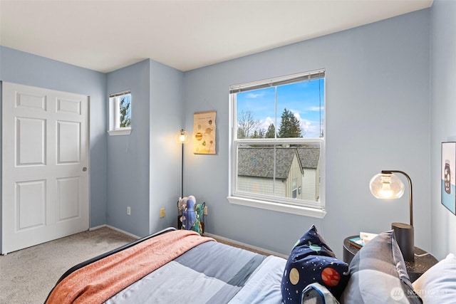 bedroom featuring carpet flooring and baseboards