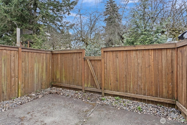 exterior space with a patio and fence