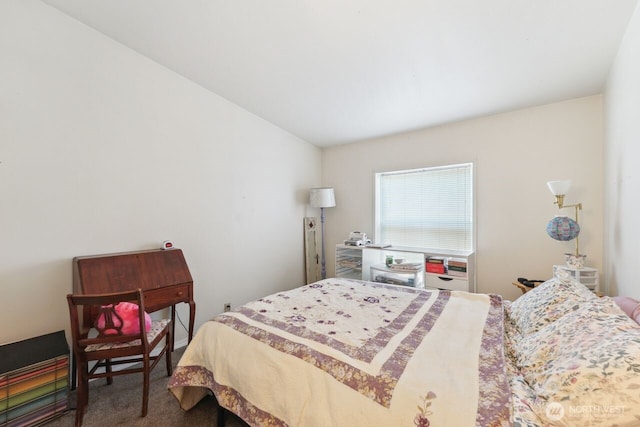 carpeted bedroom with vaulted ceiling