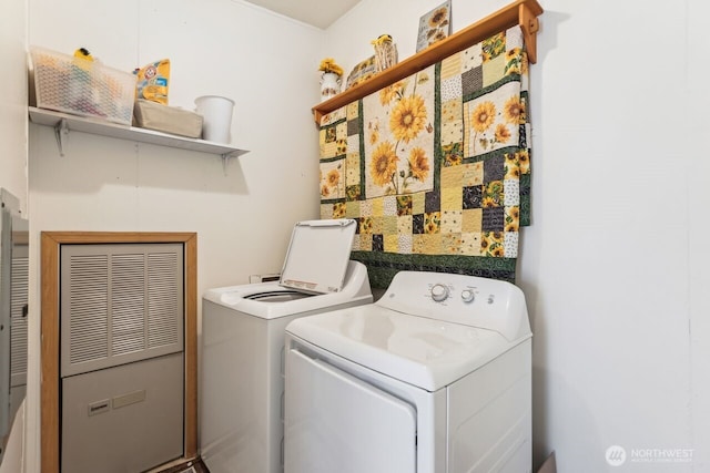 clothes washing area with laundry area and separate washer and dryer