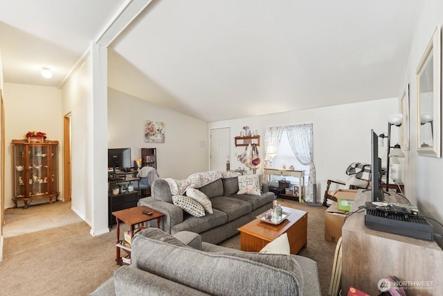 living room featuring light colored carpet and lofted ceiling