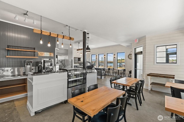 dining space featuring finished concrete flooring