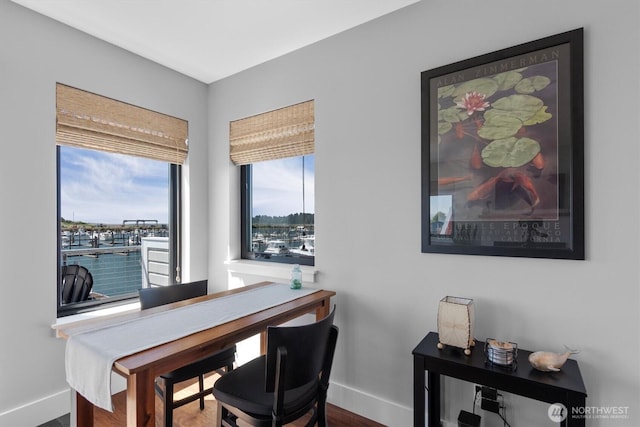 home office featuring wood finished floors and baseboards