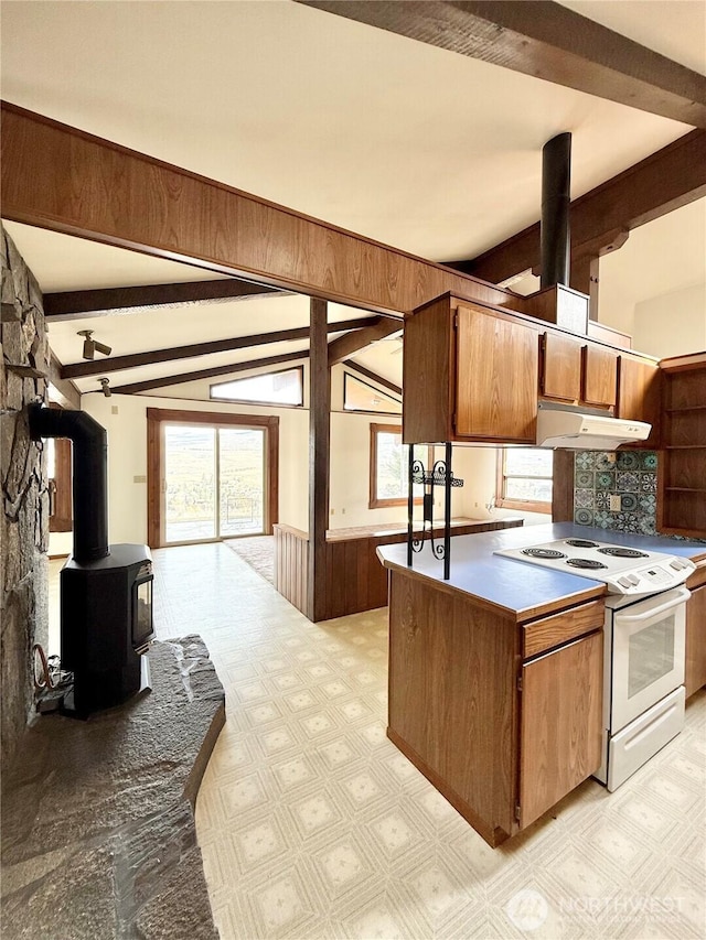 kitchen with under cabinet range hood, light floors, lofted ceiling with beams, white electric range oven, and plenty of natural light