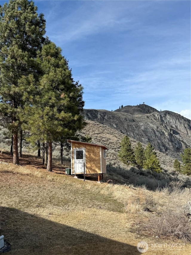 view of shed featuring a mountain view