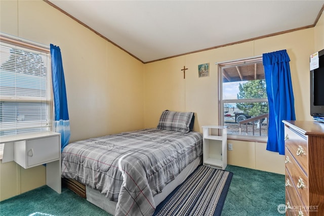 bedroom with carpet floors, lofted ceiling, and crown molding