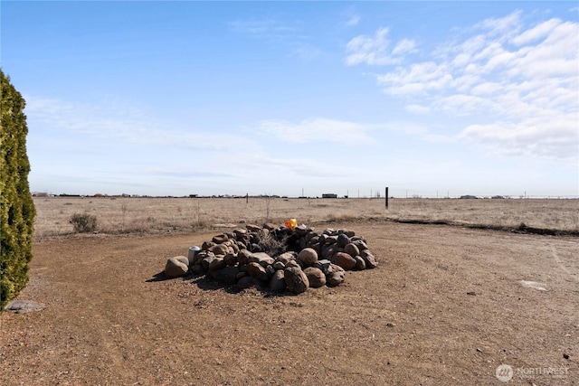 view of yard with a rural view