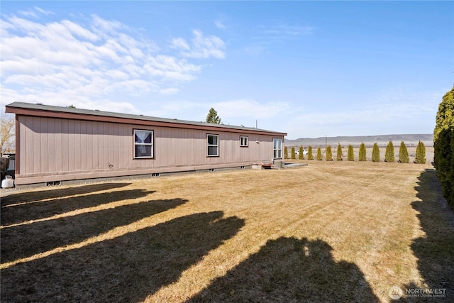 rear view of property featuring crawl space