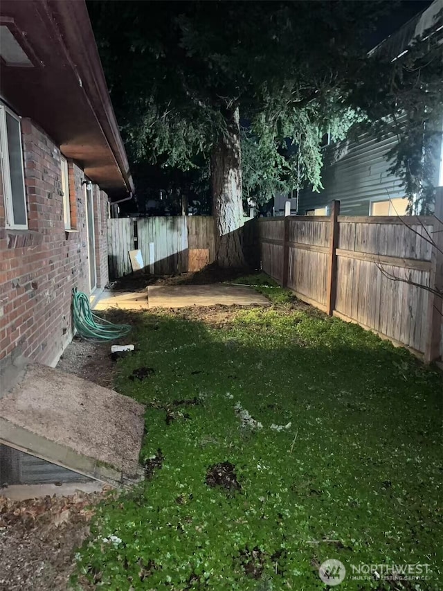 view of yard with a fenced backyard