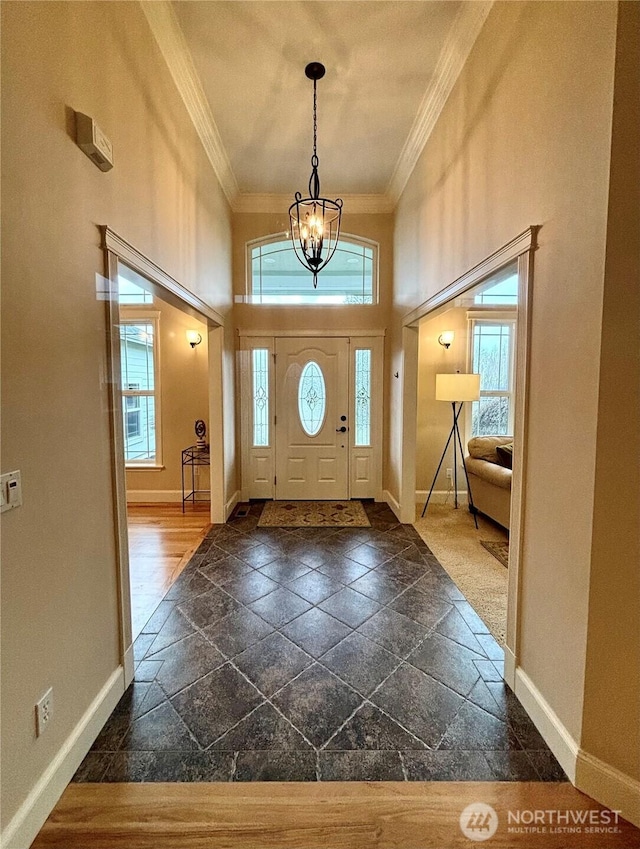 50 Holbrook Ln, Aberdeen, WA 98520 - foyer featuring stone tile flooring, crown molding, baseboards, and a towering ceiling