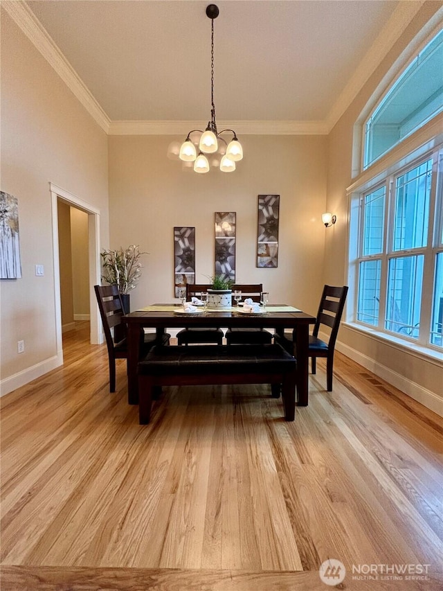 50 Holbrook Ln, Aberdeen, WA 98520 - dining space with light wood-style floors, baseboards, a notable chandelier, and ornamental molding