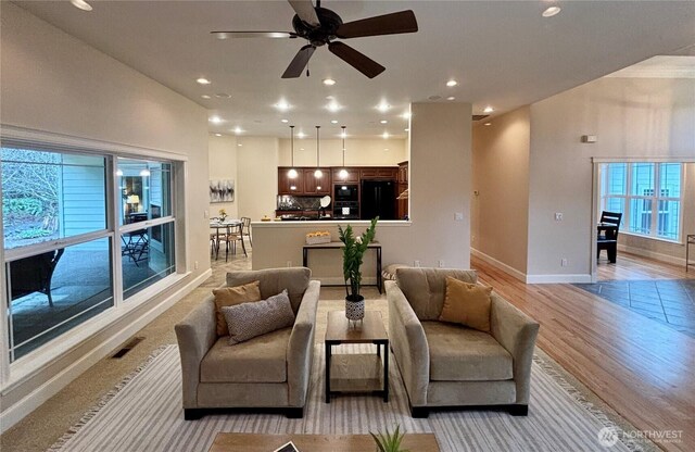 50 Holbrook Ln, Aberdeen, WA 98520 - living area featuring recessed lighting, baseboards, light wood-type flooring, and ceiling fan